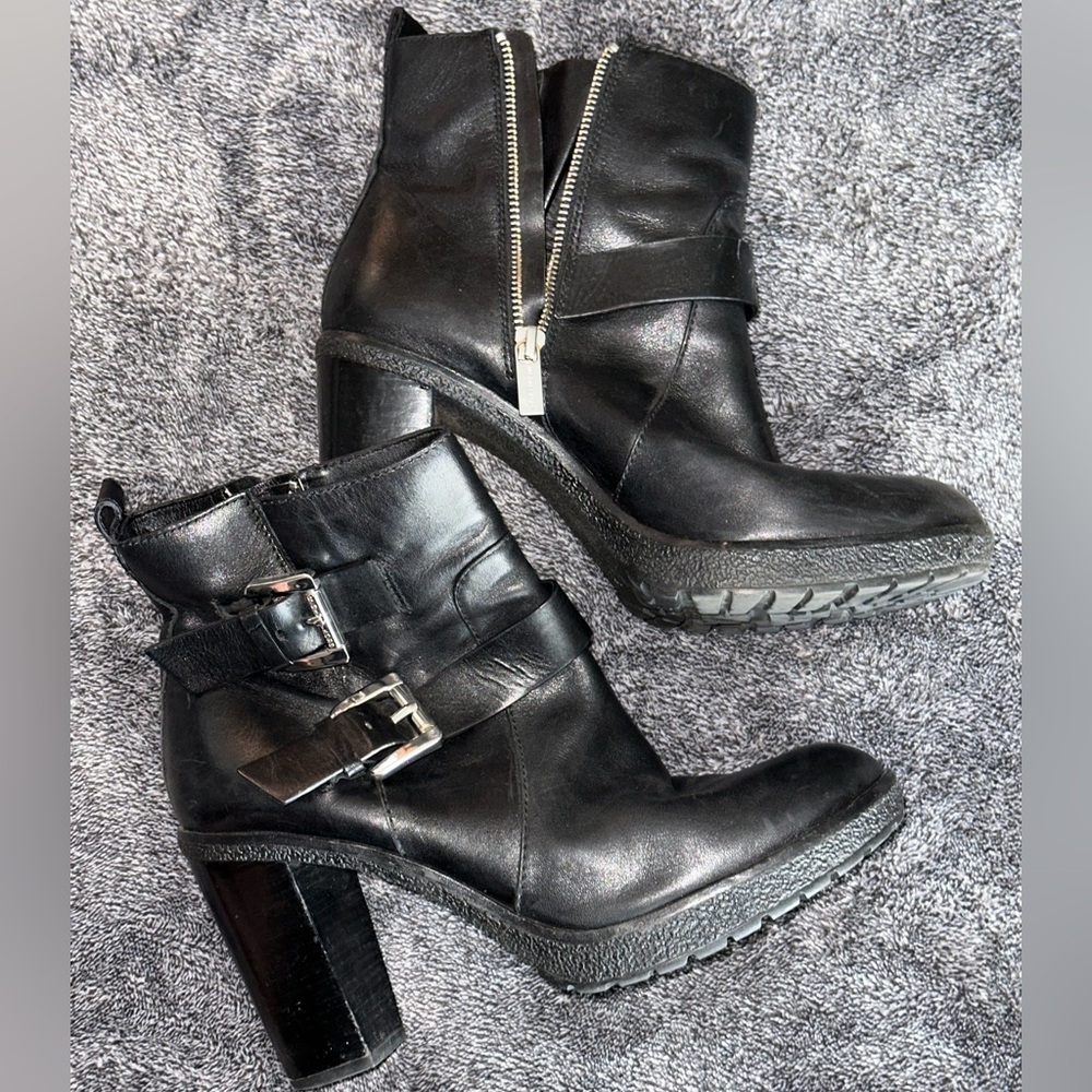 Women’s size 9 MICHAEL KORS leather high heel ankle boot with buckles and zipper
